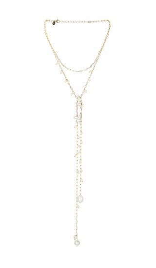 petit moments Eden Necklace in Metallic Gold. | Revolve Clothing (Global)