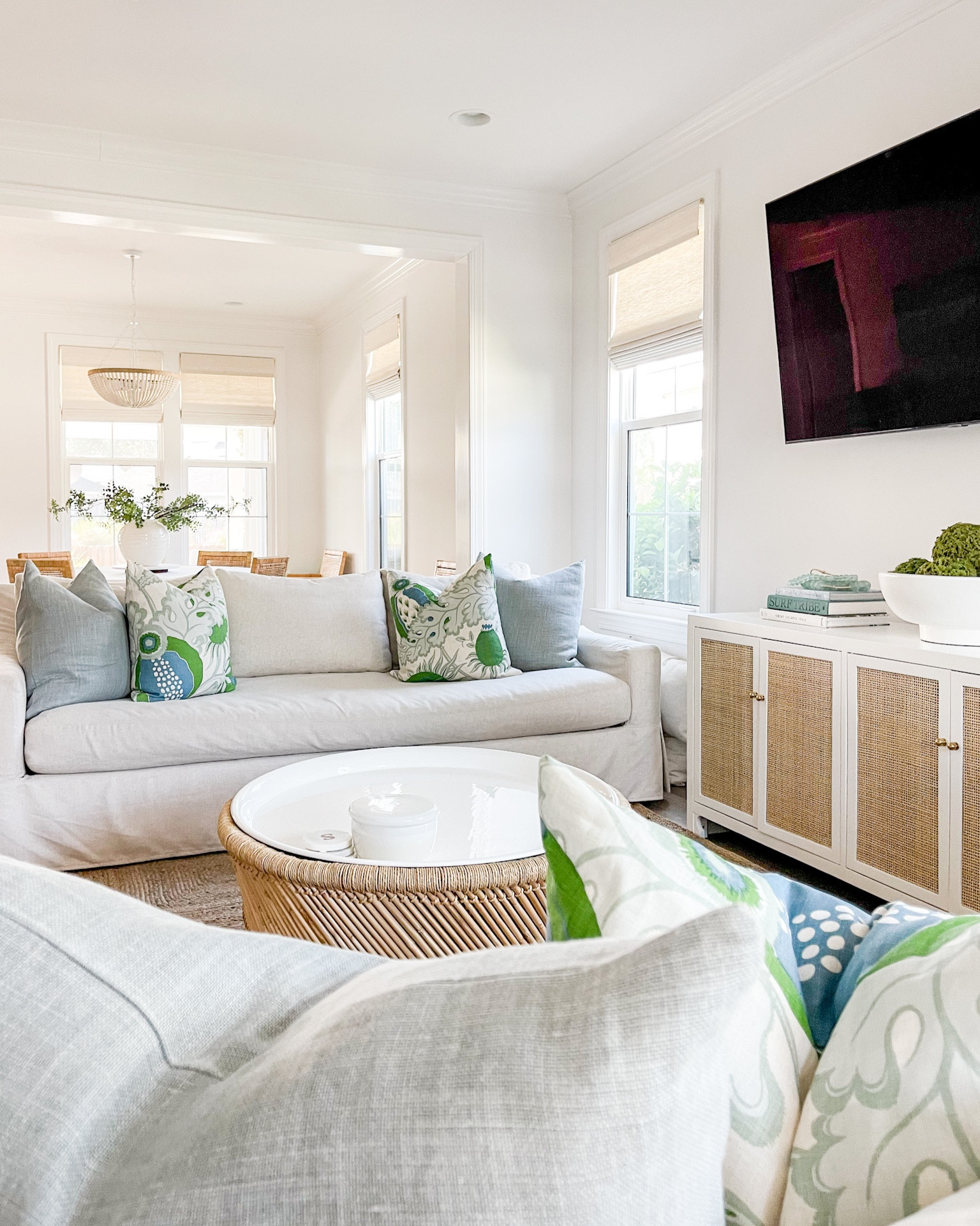 Our Florida coastal cottage living room including linen sofas, rattan cabinet, jute rug, round bamboo storage coffee table, and blue and green throw pillows.
.
#ltkhome #ltksalealert #ltkunder50 #ltkunder100 #ltkstyletip #ltkseasonal

#LTKunder100 #LTKhome #LTKsalealert