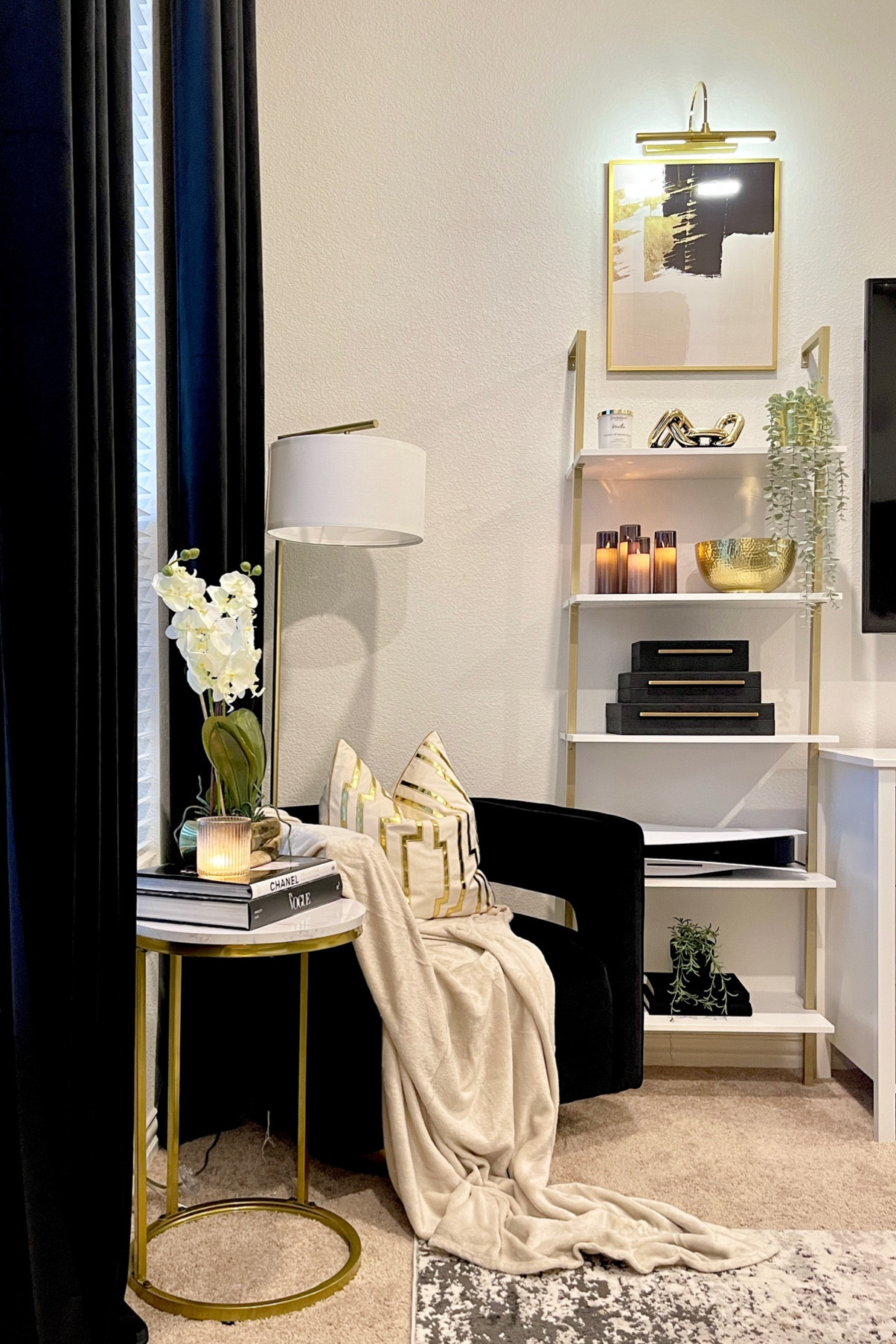 Armchair • Floor Lamp • Wall Shelf • Side Table • Coffee Table Books • Throw • Pillow •Curtains • Artwork • Picture Light • Chain Link Decor • Picture Frame • Plant • Gold Bowl • LED Candles • Decorative Boxes • Rug

#LTKsalealert #LTKhome #LTKunder50