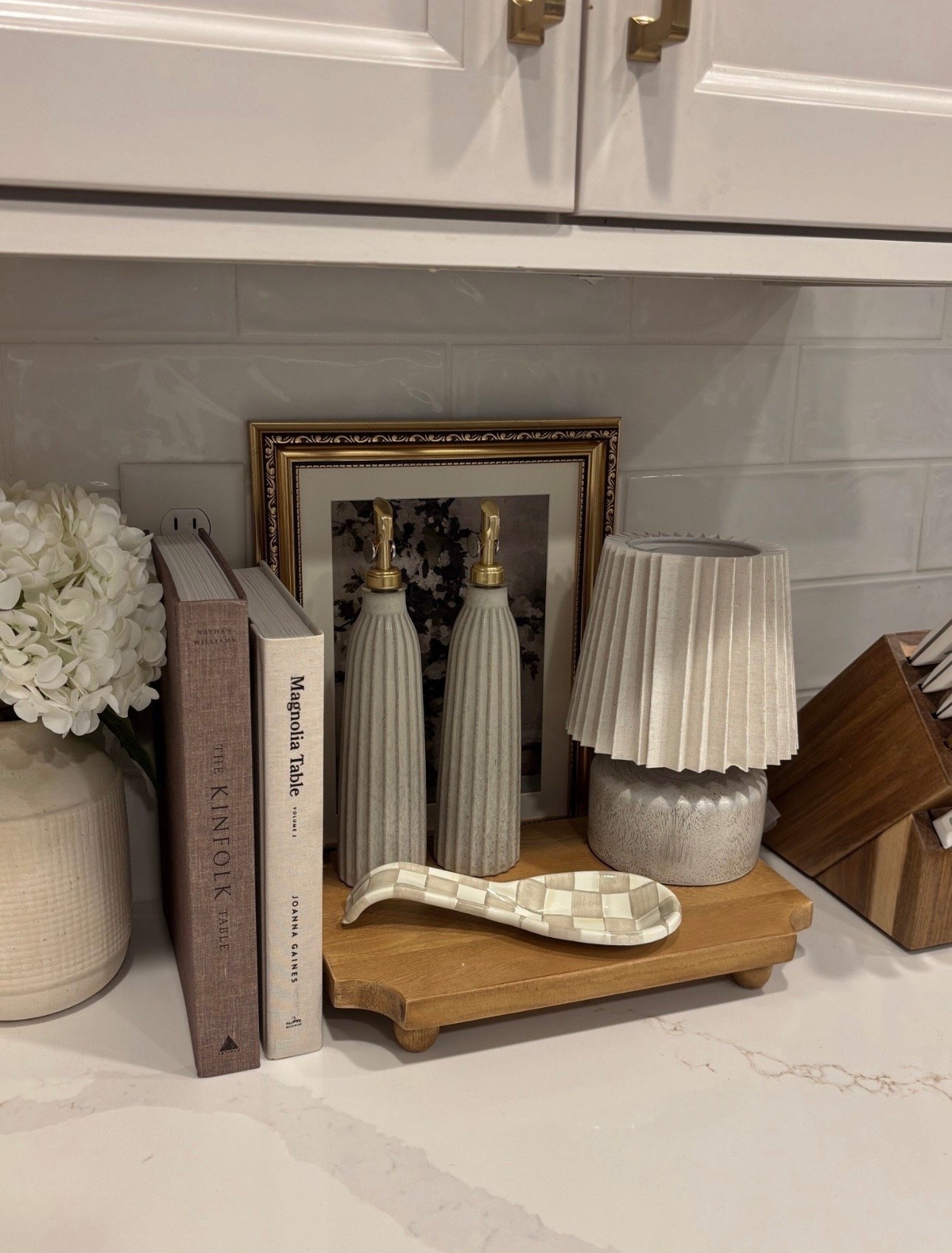 Kitchen decor favorites that I love!!🤍 this lamp is only $12 from Target and these oil bottles are back in stock! This is such a simple way to elevate your kitchen counters! 🫶🏼




kitchen decor, kitchen styling, countertop decor, styled kitchen corner, kitchen details, neutral kitchen, cozy kitchen, warm neutral decor, Nancy Meyers aesthetic, classic kitchen style, timeless home, elevated everyday, soft minimal, clean + cozy, light and airy kitchen, wood accents, marble countertop, ceramic decor, stoneware, textured ceramics, pleated lamp shade, mini kitchen lamp, kitchen lamp decor, decorative tray, wood riser, framed art, cookbook styling, Magnolia Table book, Kinfolk book, oil dispenser bottles, soap dispenser set, decorative spoon rest, wood cookbook stand, small table lamp kitchen, layered decor, styled surfaces, curated home, simple but elevated, neutral color palette, beige + cream tones, modern classic, organic textures, amazon home finds, target home decor, affordable home decor, budget friendly decor, looks expensive, designer inspired, home upgrades, small space styling, romanticizing your kitchen, little details that make home feel special, making everyday moments feel elevated, slow mornings at home, cozy cooking nights, creating a home you love

#LTKHome

#LTKHome