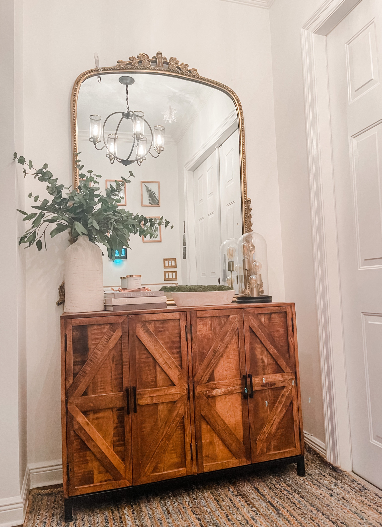 Entryway decor | entryway furniture | transitional style | rustic | faux eucalyptus | primrose mirror | anthropology home | shelf decor | book styling | home decor 

#LTKstyletip #LTKhome