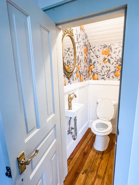When you don’t have a powder room for guests in an 1876 farmhouse, you get creative and have some fun with color and design!  This closet under the stairs was divided back into two spaces to create a half bath. The entry to the storage area reused a door in the original home to create an entry point in the main hallway. 



#LTKhome