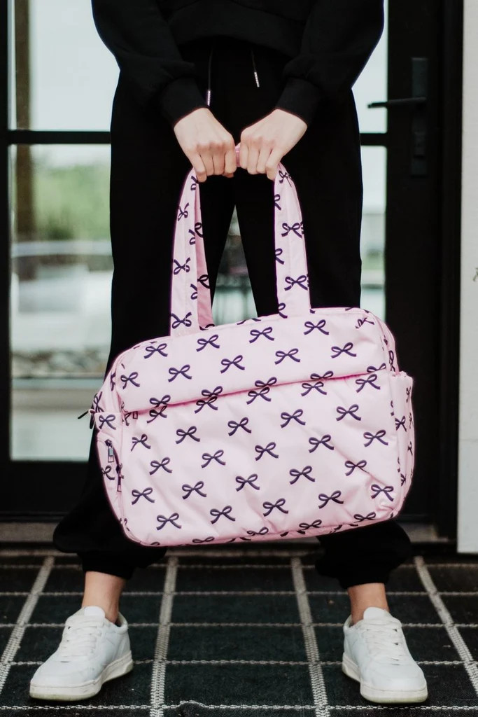 Black & Pink Mini Bows Duffel Weekender w/ Pass-Thru Slip | Katydid.com