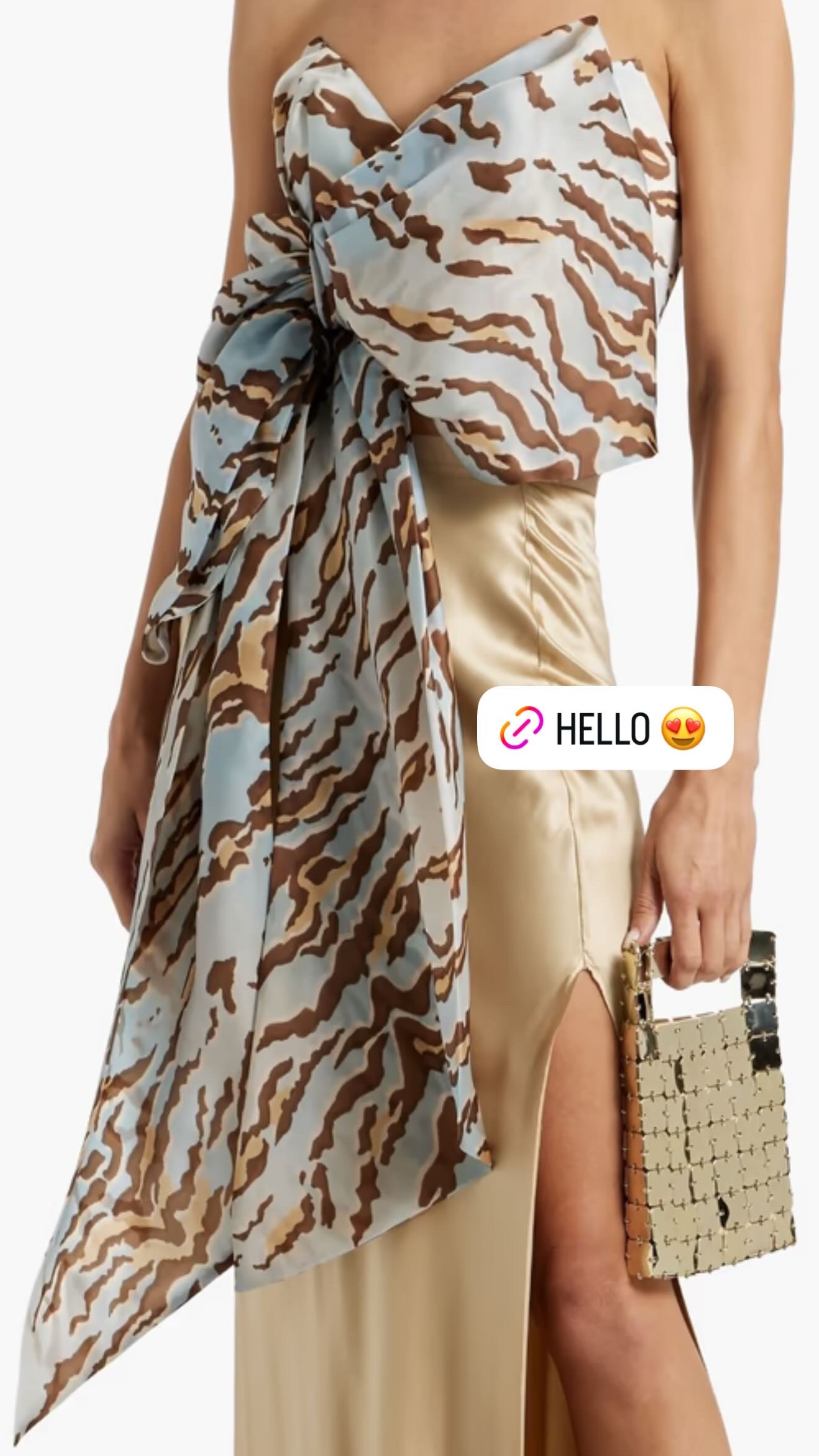 Zimmermann silk organza for $298. I'll wait while you do the math.
This strapless top is originally $850 — it's currently 65% off at The Outnet and I'd feel like I was withholding information if I didn't say something. Zebra-print silk organza, internal boning so it actually stays up, a bow detail at the neckline that reads more sculptural than precious, and a back zip closure. It's constructed, not flimsy — this is not a tube top situation.
The styling range is wider than you'd think. Tailored wide-leg trousers and heels for a night out. A sleek black midi skirt and a strappy sandal. Even high-waisted white denim if you want to take it somewhere more casual and unexpected.
Real talk: silk organza means dry clean only, and the fit is non-stretchy so sizing accuracy matters here. Check The Outnet's size guide before you order — final sale items at this discount move fast and there's likely no return safety net. 

 