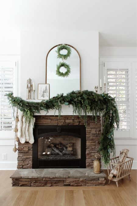 Holiday styling inspiration has arrived for all of your shopping needs ✨ This garland is beyond affordable, and currently on sale! Shop the entire look on megleonard.co via the link in bio
•
•
•
Fireplace mantel garland, Christmas garland, affordable holiday home decor, Michael’s garland, stocking decor, holiday home tour, neutral Christmas, simple Christmas decor, brass decor, holiday home inspo, candle holder, mirror, brass decor, nutcracker, hanging bells 

#LTKSeasonal #LTKHoliday #LTKhome