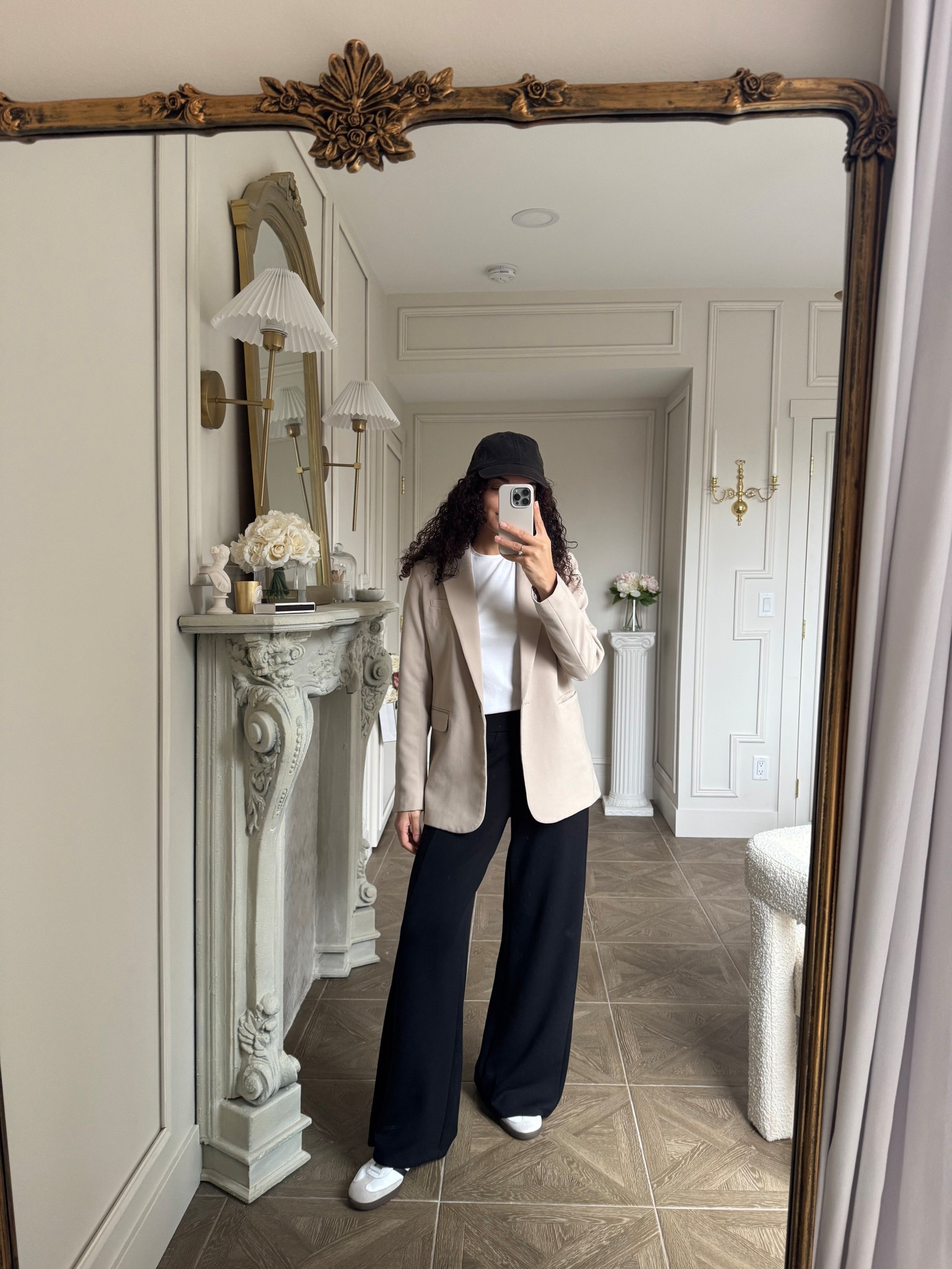 Travel outfit idea: stretchy spanx black pants, white tee, blazer, sneakers, baseball cap 

#LTKootd