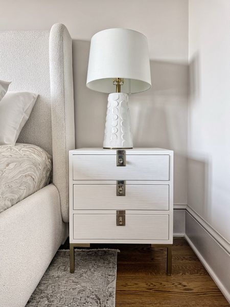 A new favorite nightstand from Anthropologie! 

White painted with the woodgrain showing through and gold/chrome hardware allows for you to easily mix and match medals in your bedroom

#LTKSummerSales #LTKSaleAlert