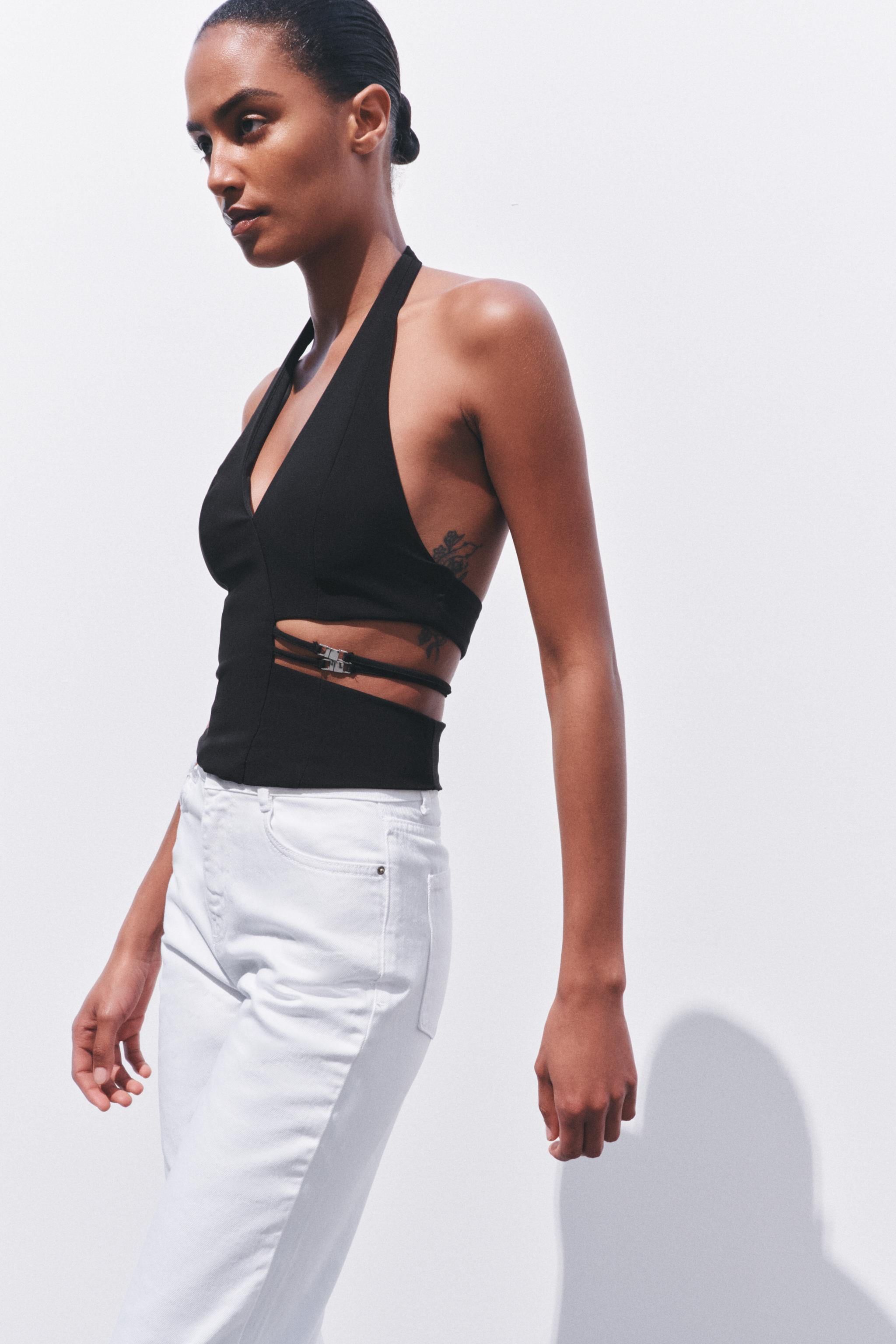 Halter top with a v-neck and open back. Cutout detail at the waist with thin straps and metallic ... | Zara US