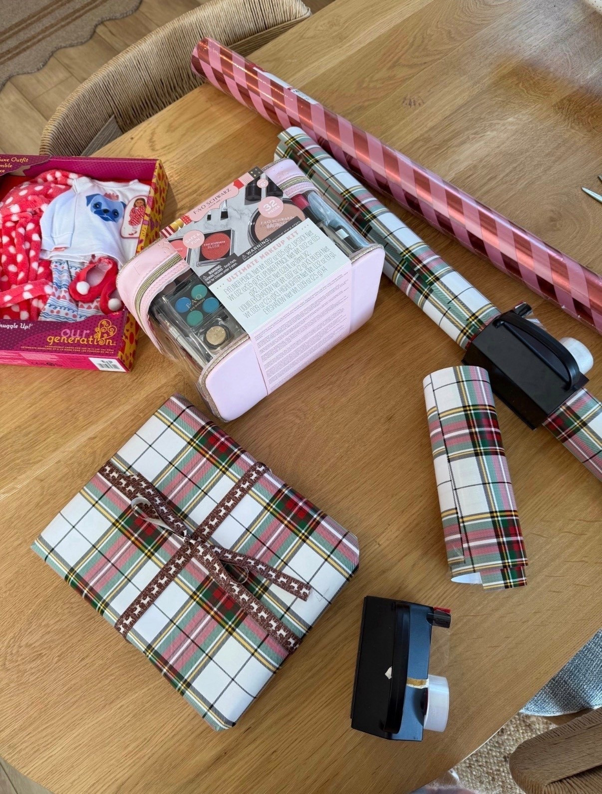 Proof that the wrapping is half the gift 🎁✨
I love having a stash of pretty wrapping paper, gift bags, and a good tape dispenser on hand — it makes even last-minute gifts feel thoughtful and pulled togethere together. These classic plaid papers are my go-to every year, and the tape runner is a total game-changer (no fighting with tape while wrapping on the floor).

🎄 Simple, festive, and actually makes wrapping fun.