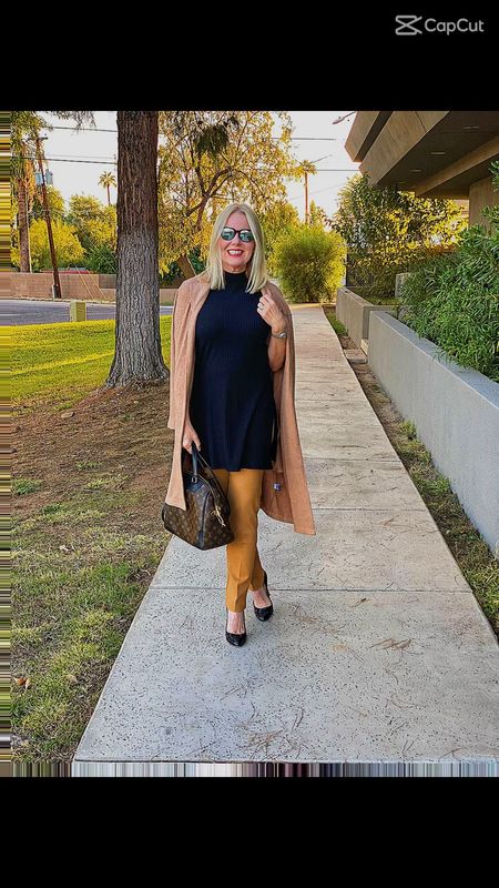 Camel & black, are you a fan? 
🖤🧡
I’m Walking into the weekend with some extra pep in my step thanks to this classic color combo. 
🖤🧡
My recipe for today, a pair of @lovechicos so slimming @360 Juliet Full length camel colored  pants, a classic black mock tunic and for extra style, a full length camel cardi worn casually over my shoulders. 
🖤🧡

The sweater is from my favorite @lovepeach fall collection, the link is in my bio.  I’ve linked the rest of the outfit on my LTK page.



#LTKworkwear #LTKSeasonal