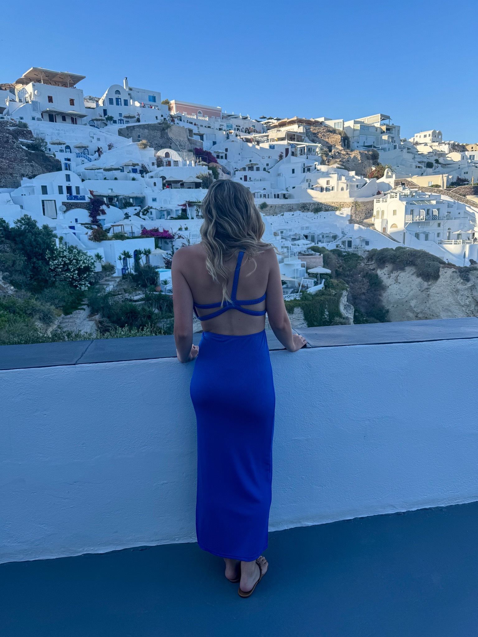The perfect vacation maxi dress and a great pop of color in the cliffs of Santorini 💙

#LTKFindsUnder100 #LTKStyleTip #LTKTravel