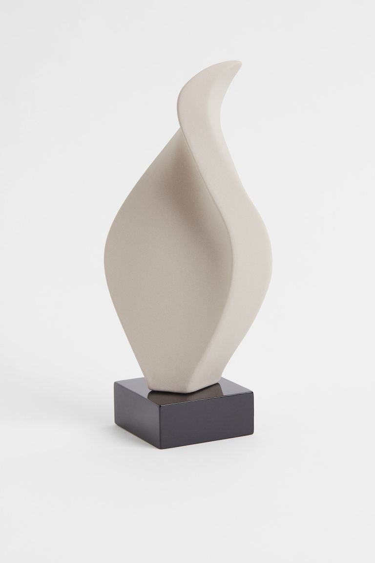 Large stoneware sculpture with a soft, asymmetric design. Mounted on a painted, medium-density fi... | H&M (US)