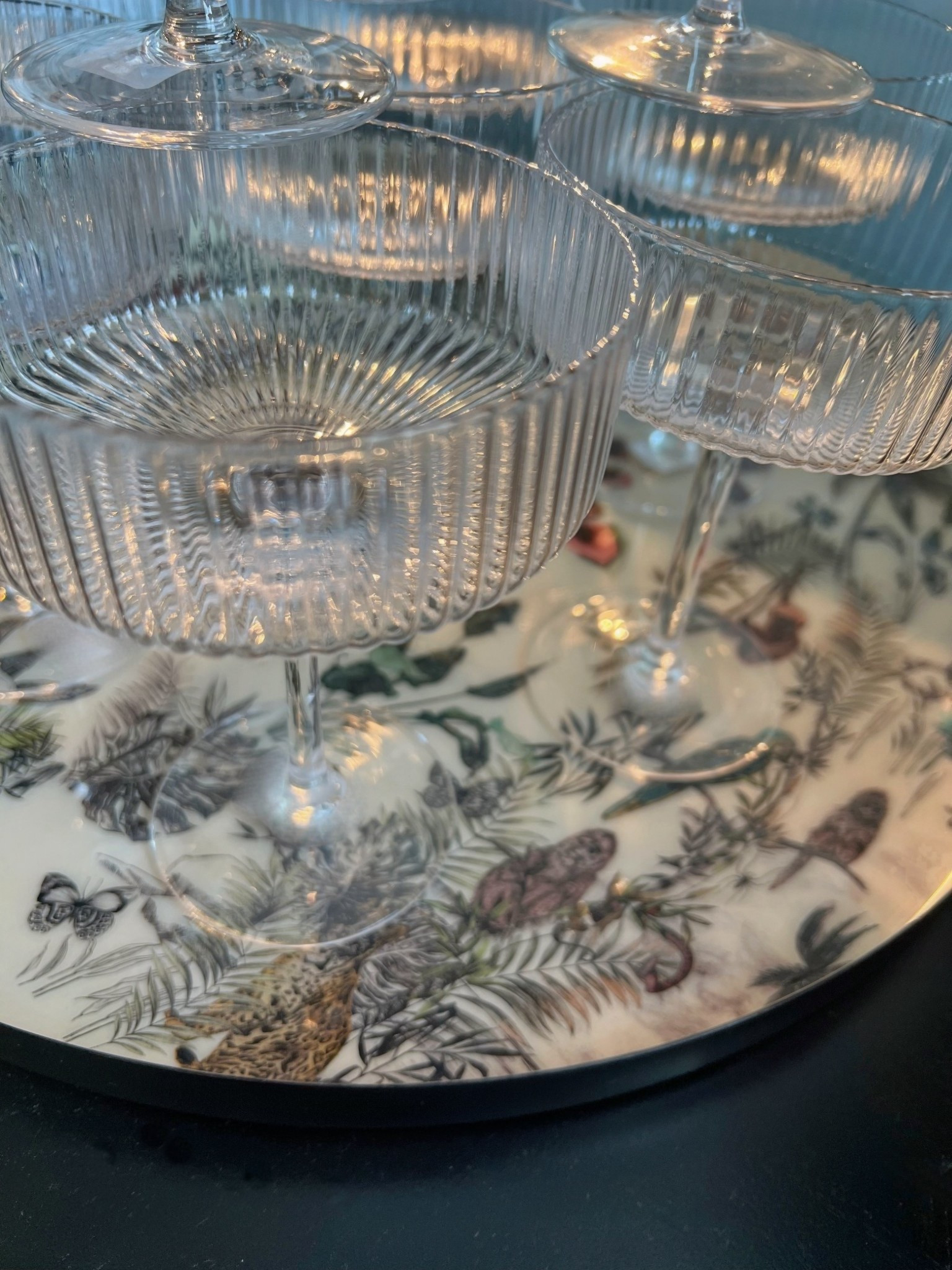 Coupe glasses just set a different vibe, mood. These are fluted with a ribbed detail, so pretty in person. And fun for cocktails, entertaining and NYE parties ✨  

#LTKFindsUnder100 #LTKHome #LTKSaleAlert