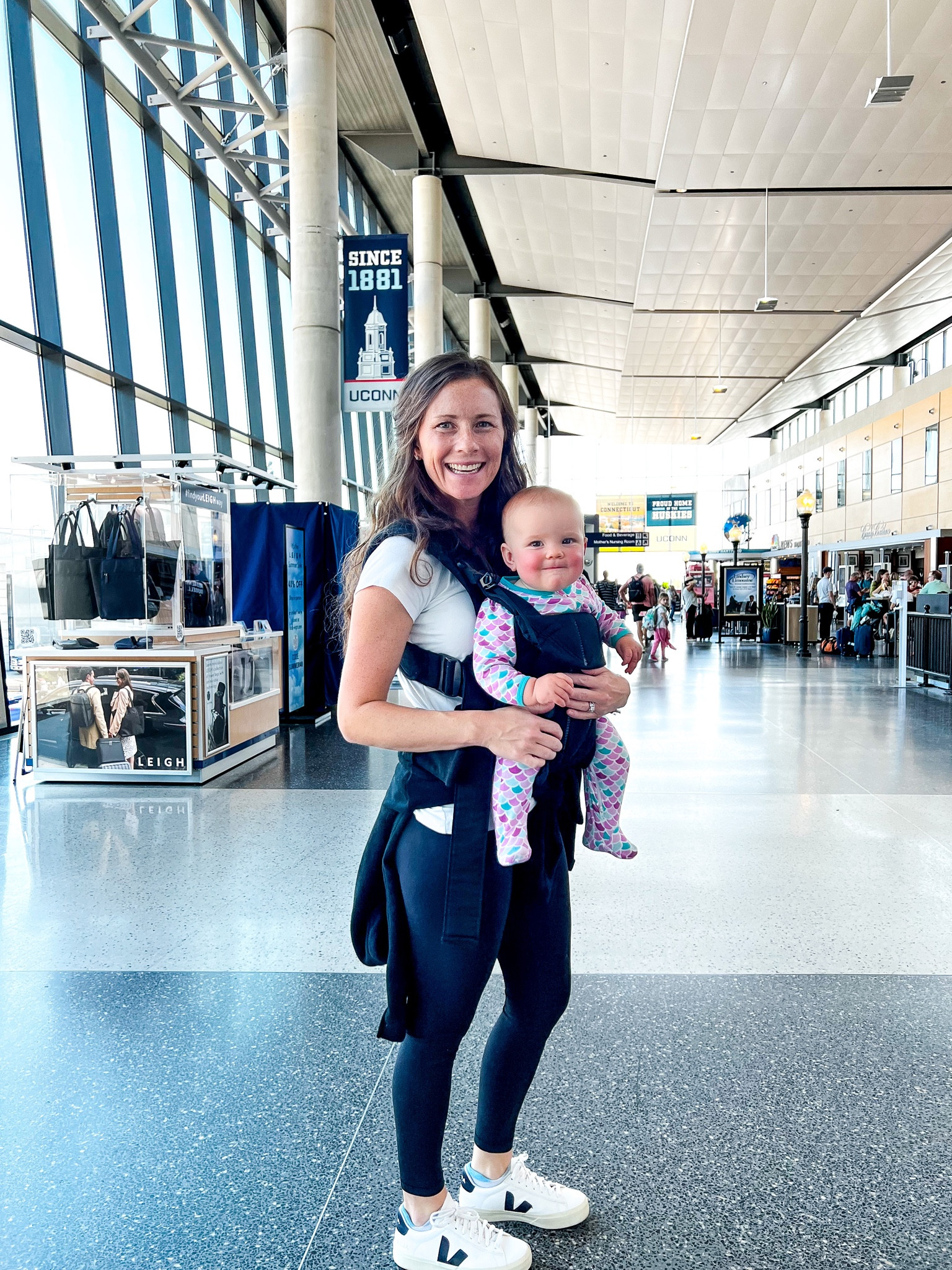 What to wear while flying with a baby - the best airport outfit for Mom and Baby. T-shirt, align leggings, Veja sneakers and socks, hooded or zip up sweatshirt. Baby wears foot pajamas with two way zip.  

#LTKbaby #LTKtravel