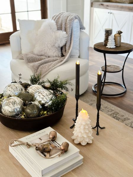 Coffee table decor idea for the holidays!  Modern organic, woodland Christmas, swivel chair, reclaimed wood table, decor books, living roomm

#LTKhome #LTKsalealert #LTKstyletip