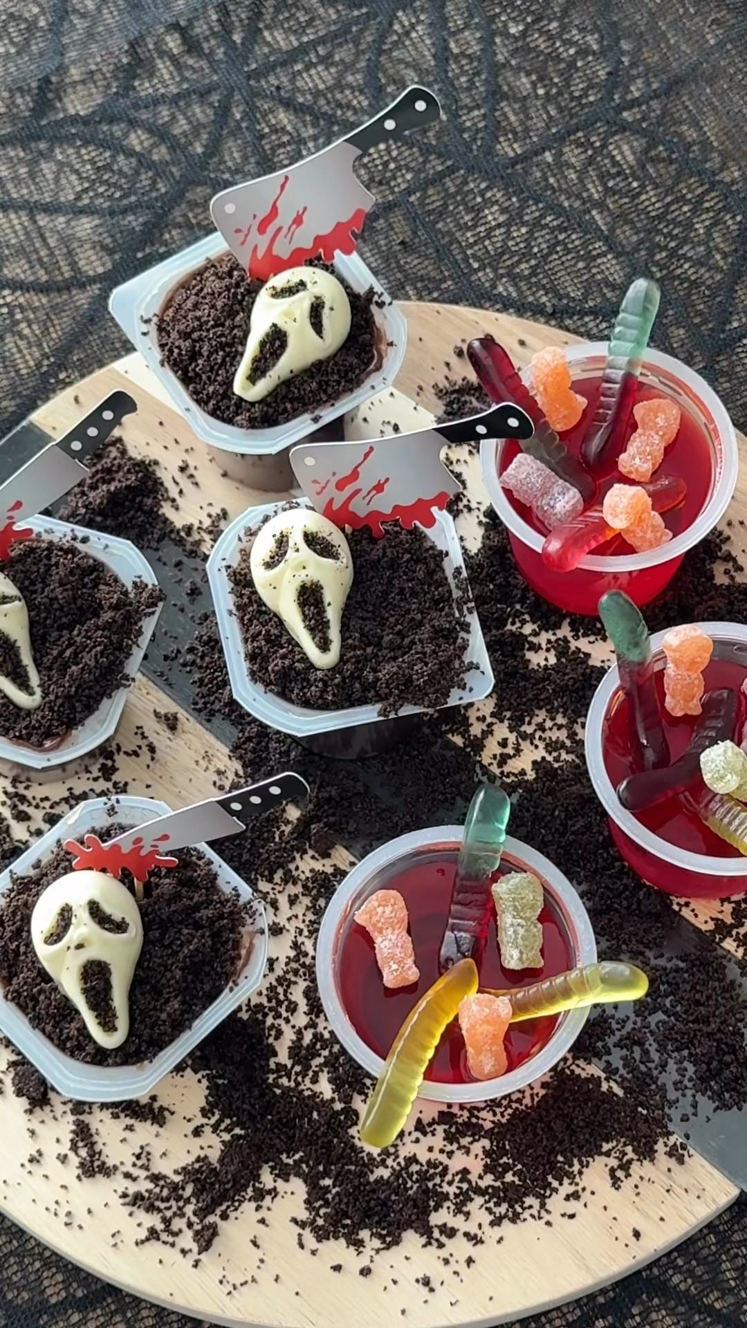 Desserts that are to die for! 💀🔪🩸
I’m sharing two super easy spooky treat ideas! I used ready made chocolate pudding and strawberry jello. I added crushed Oreos to the top of the pudding and then topped them with white chocolate skulls using a mold from @shapedicemolds 💀 
For the strawberry jello I topped them with gummy worms and zombies from @smartsweets 🪱 
Which one would you try? 

#halloween #spookyseason #dessert #halloweendesserts #halloweeninspo #funforkids

#LTKHome #LTKParties #LTKSeasonal