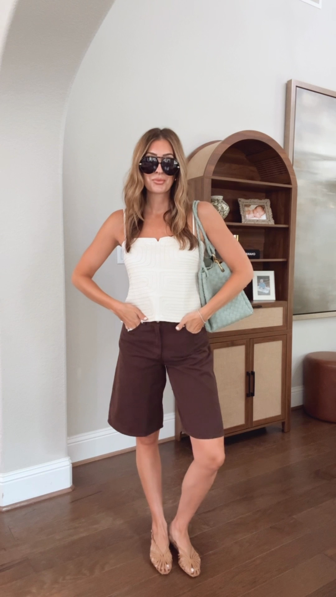 Size 4 in top, 25 in shorts (definitely size down at least one size)