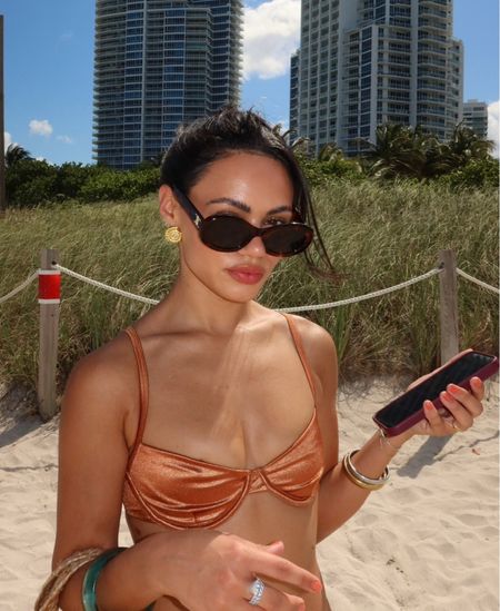 Miami Beach style
monday swimwear bronze bikini set, revolve shell Nelly chain, monday swimwear black trousers

#LTKSwim #LTKStyleTip #LTKFindsUnder100