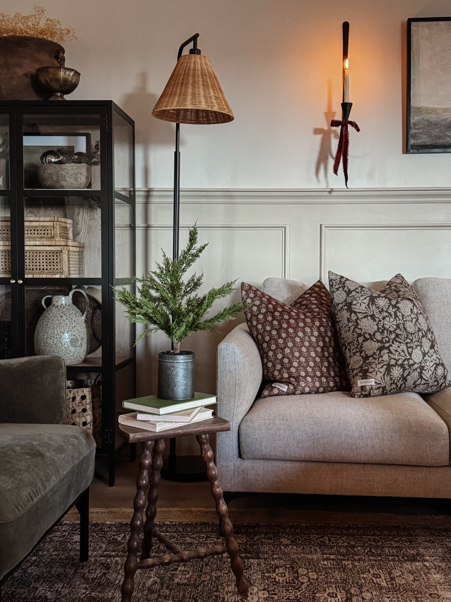 Living room inspo, custom curtains, pinch pleat curtains, floor to ceiling curtains, neutral sofa, beige sofa, west elm penn chair, green accent chair, vintage pillows, Turkish pillows, boucle pillow, shady lady tree, faux tree, greenery, Walmart floor lamp, woven table tray, square wooden coffee table, wall sconce, tapered candle holder, citrus tree, throw pillows, floor length mirror, arch mirror, Target home decor, affordable home, black cabinet, studio McGee cabinet, round glass coffee table, target accent table, vintage inspired rug, vintage milking stool, foot stool