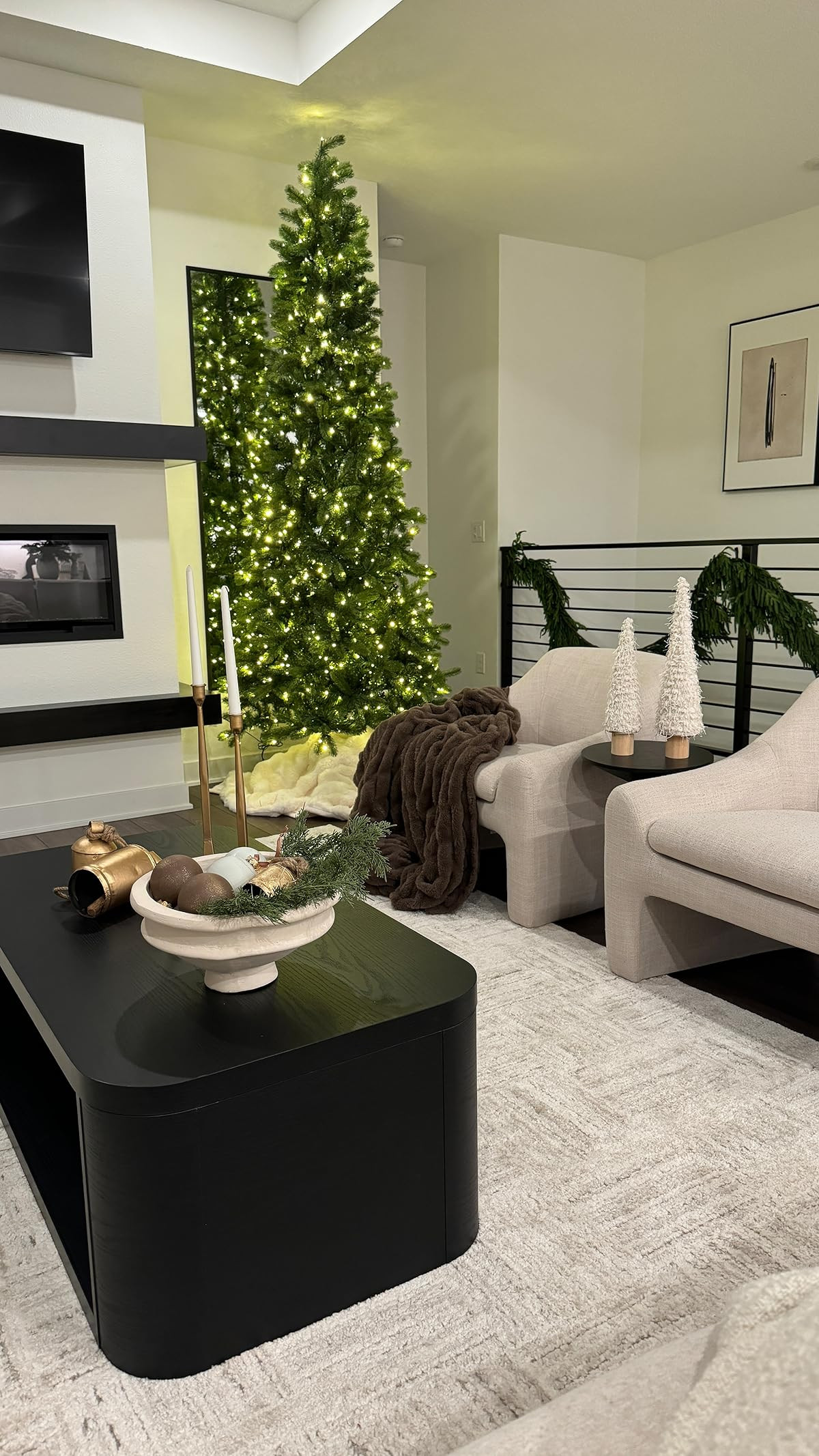 My Christmas living room—extra cozy, warm, and all dressed up for the season 🎄✨ Love this bowl of greenery and ornaments, and the bells add a little charm to my coffee table with the gold candlesticks.   

 

#LTKHoliday #LTKSeasonal #LTKHome