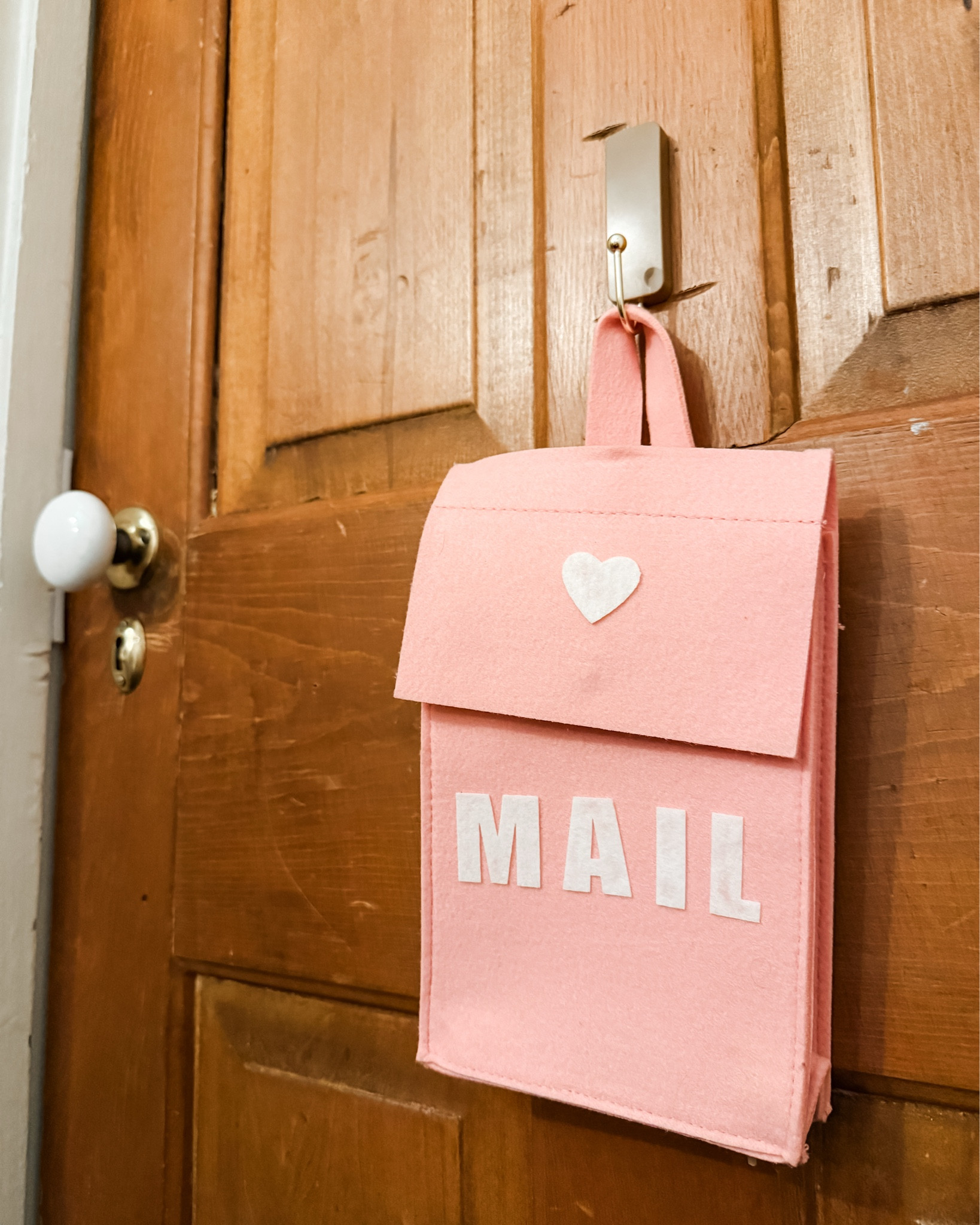 Starting a little Valentine tradition over here 💌 I found these felt Valentine mailboxes for each of the kids (pink for my girl, red for my boy!) and hung them right on their bedroom doors with decorative Command hooks. Planning to sneak in lots of little valentines over the next few weeks—notes filled with love, encouragement, and sweet reminders of how loved they are. Such a simple way to make February feel extra special 🥰✨

#LTKSeasonal #LTKmomlife #LTKKids