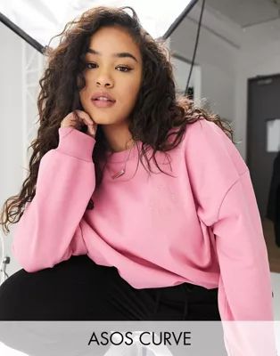 ASOS Weekend Collective Curve oversized sweatshirt with tonal embroidery logo in washed pink | ASOS (Global)