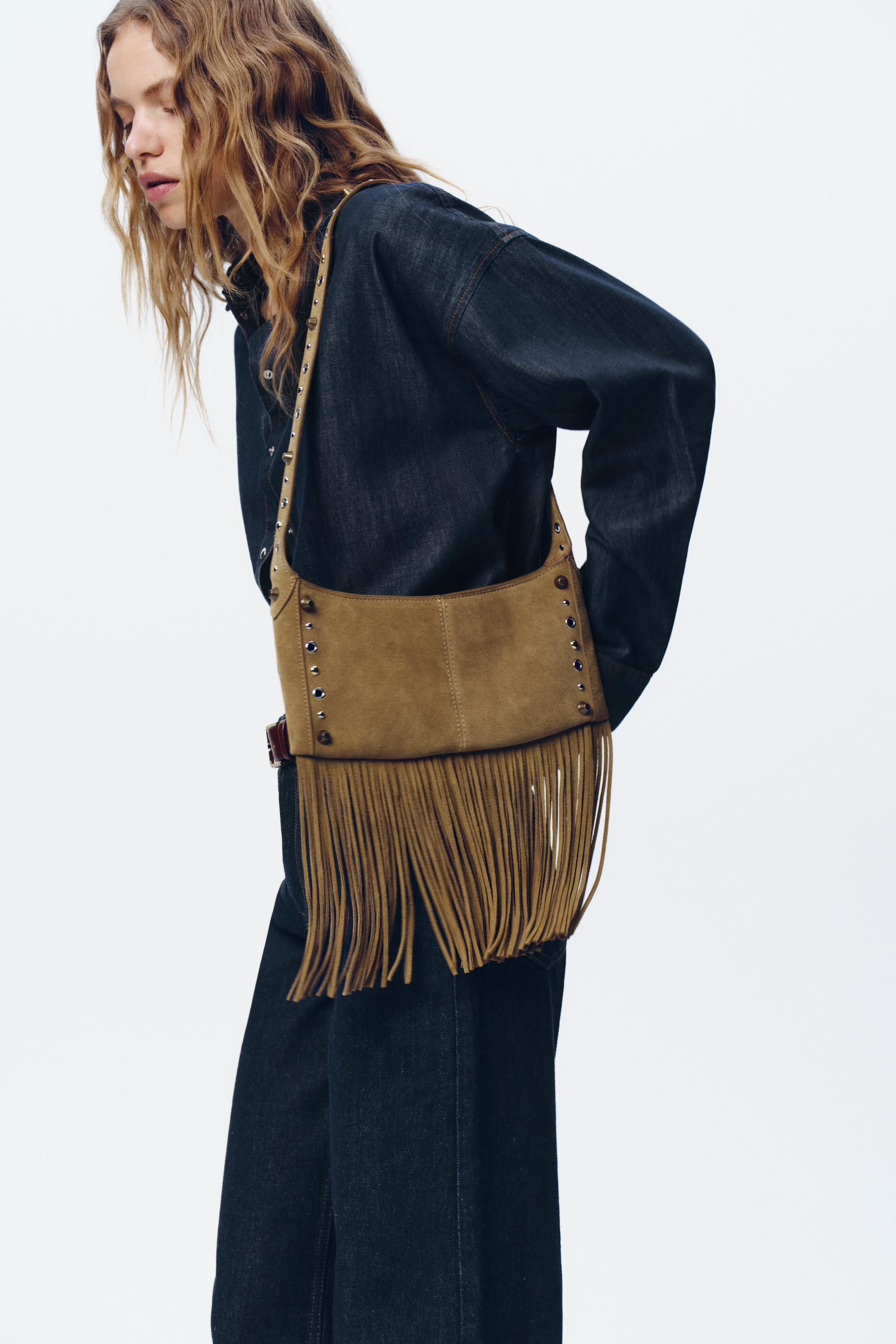 Suede shoulder bag. Fringed trim. Stud and grommet detail on the body and strap. Interior zip poc... | Zara US