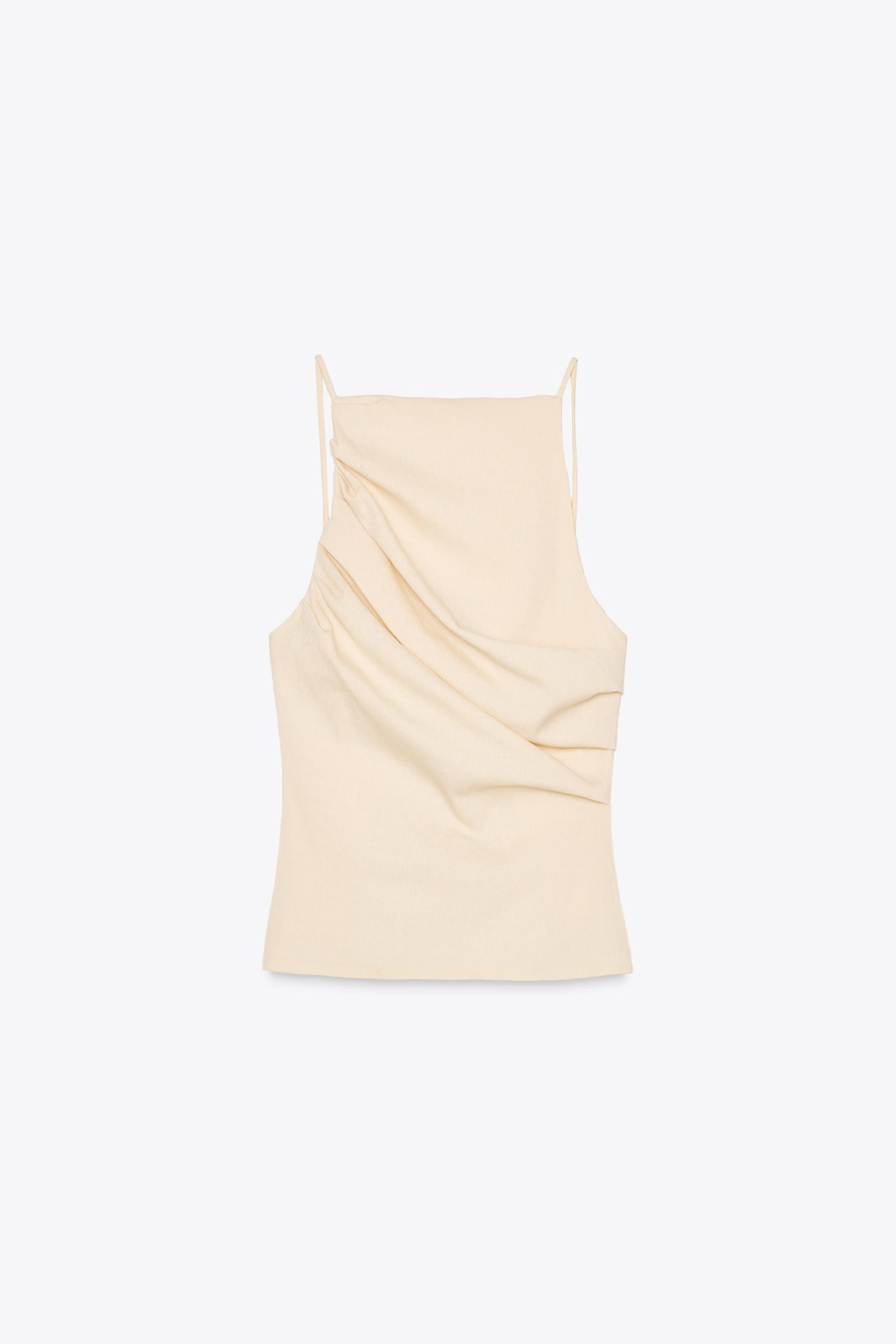FEW ITEMS LEFTGATHERED ELASTIC TOP17.99 GBPPastel yellow | 5039/351/321Put it in your basketAddMa... | Zara UK