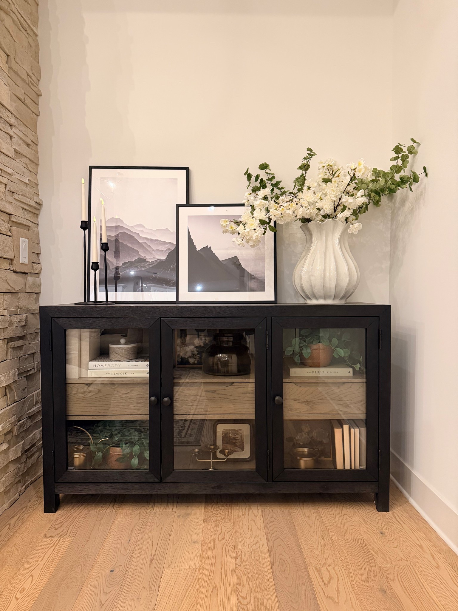 Spring is on the horizon and I rather decorate for the season ahead. It gives me the sense of anticipation and excitement.
This area next to my fireplace got a few updates with cherry blossom stems and leaves from Amazon. 

#LTKFindsUnder100 #LTKFindsUnder50 #LTKHome
