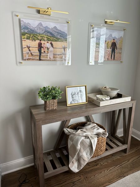 Entryway table 
Amazon home 
Wooden bowl 
Wood chain link decor 
Barefoot dreams dupe blanket 
Acrylic photo frame 
Photo light 


#LTKunder50 #LTKhome #LTKunder100