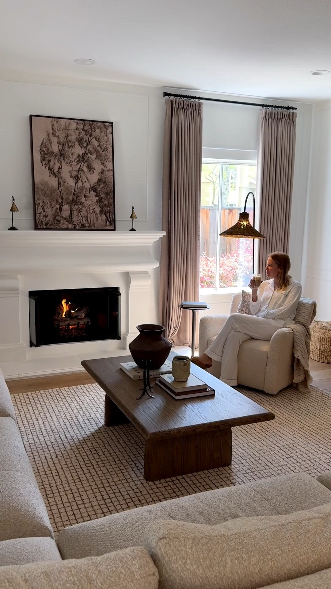 I always get asked about the art on my mantel — it’s from Collection Prints, printed on canvas in a 30x40 espresso float frame. It makes such a beautiful focal point in my family room.
If you’re looking for a cozy and great quality PJ to enjoy slow days at home, I highly recommend this one by Cozy Earth. Best and softest pajama I ever had.
Curtain details: Two Pages Liz Linen
Color Grey Beige, triple pleat, privacy lining, memory shape. Use code PAULABHOME for 22% off your Two Pages order  

#LTKStyleTip #LTKSeasonal #LTKHome