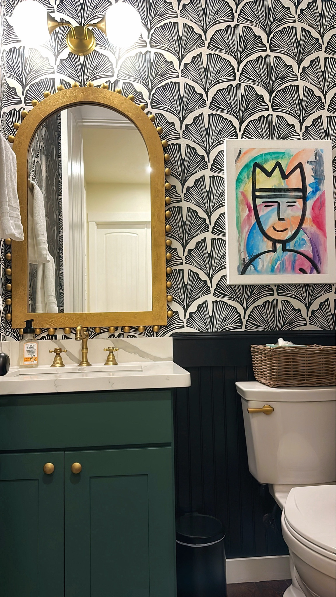 Powder Room update. Fell in love with this fun wallpaper, added black wainscoting, painted the existing vanity cabinet, added new countertop, sink and faucet, sourced a fun mirror and transformed it to gold, added fun custom artwork. Sourced links below. Bathroom renovation. Wallpaper lover  

#LTKHome