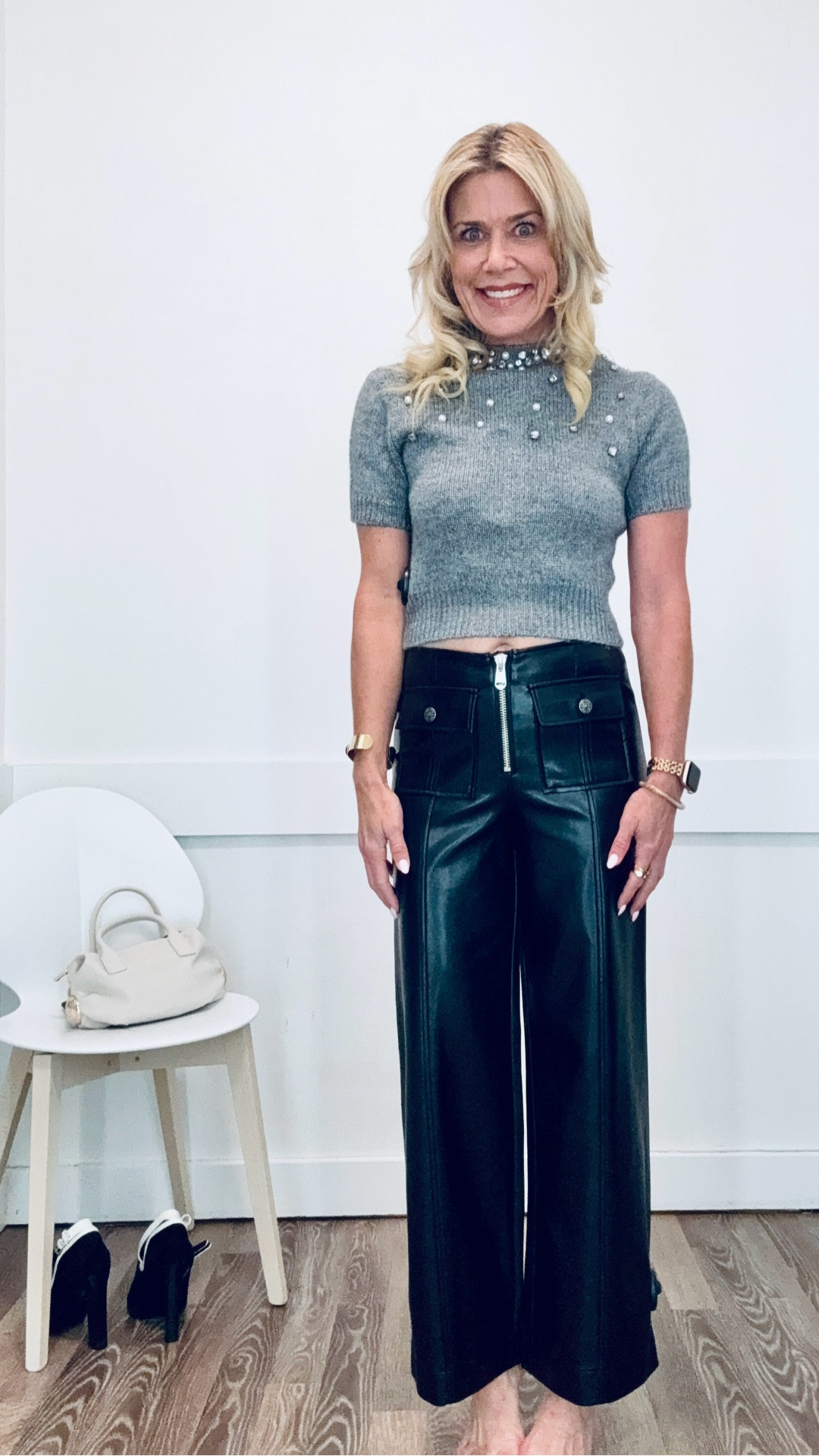 Love this outfit for the holidays or cool fall or winter days. These faux leather black pants fit like a glove and the zipper and details are so slimming. Wearing an embellished cropped cardigan styled backwards to look like a top and slim you from behind with buttons. Wearing size XS top fits snug but well and size 2 pants which are true to size. 

#LTKHoliday #LTKSaleAlert #LTKGiftGuide