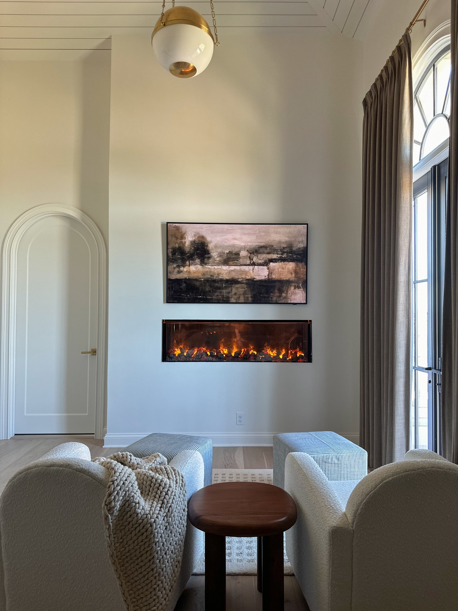 Master sitting area, boucle chairs, side table, frame tv, linear fireplace, throw blanket, ottoman

#LTKHome