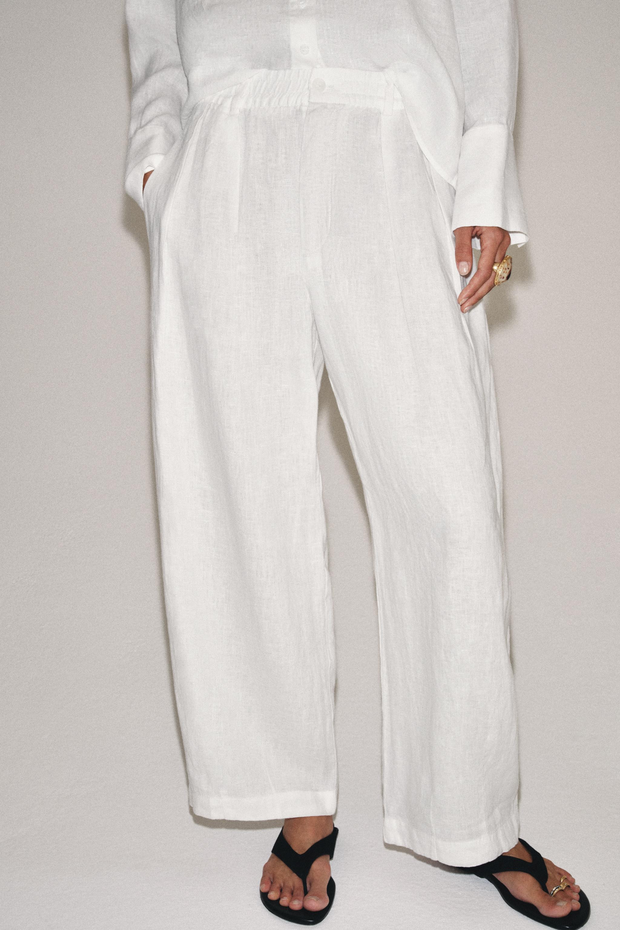 Model height: 178 cmZARA WOMAN COLLECTIONTrousers made from 100% linen. Mid-waist with an elastic... | Zara UK