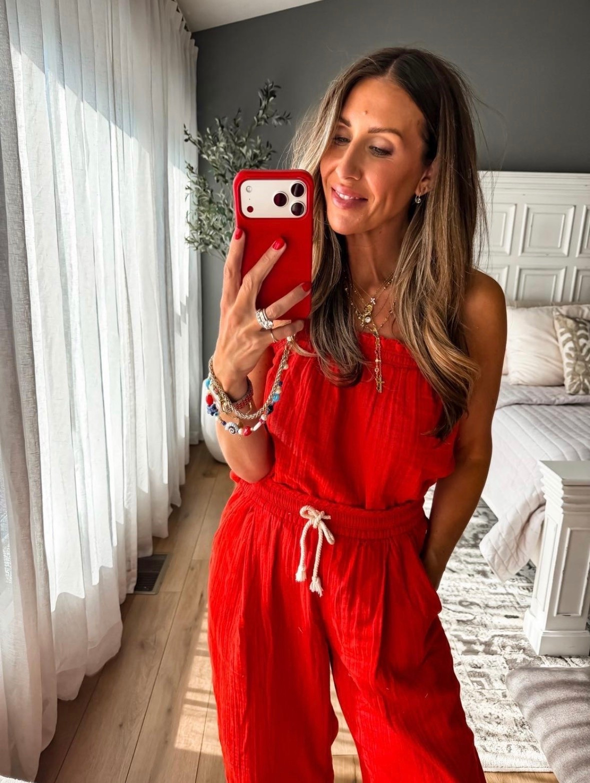 This red set is made from a lightweight crinkle fabric that keeps you cool while still looking put together. The relaxed fit, adjustable drawstring waist, and bold color make it an easy choice for vacation, summer dinners, or holiday weekends when you want to be comfortable without sacrificing style.

red matching set, summer matching set, vacation outfit, crinkle fabric set, resort wear, lightweight summer outfit, casual chic style, travel outfit, summer fashion, red outfit ideas, TheMomInStyle

#LTKootd #LTKSeasonal #LTKTravel
