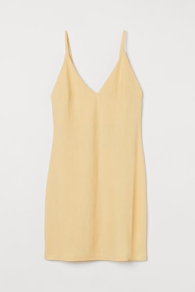 Short, fitted dress in a woven viscose blend. Narrow shoulder straps, low-cut V-neck, and double ... | H&M (US)