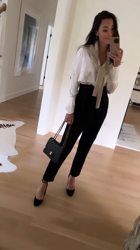 Kat Jamieson wears black trousers, a Bardo Collective silk button down blouse, a cashmere sweater, pumps and a Chanel bag to an event. Workwear, office style, classic outfit, neutrals, trouser, high waisted pant. 

#LTKworkwear #LTKitbag #LTKshoecrush