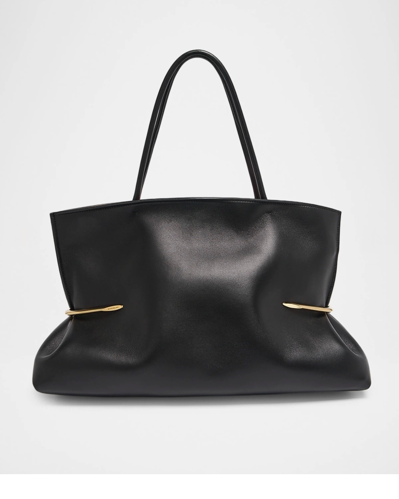 Givenchy
Pinch Squeezed Tote Bag in Nappa Leather

This Givenchy "Pinch Squeezed" tote bag is crafted in an east-west silhouette of supple nappa leather, finished with golden-finish metal pinches

#LTKSeasonal #LTKWorkwear #LTKTravel