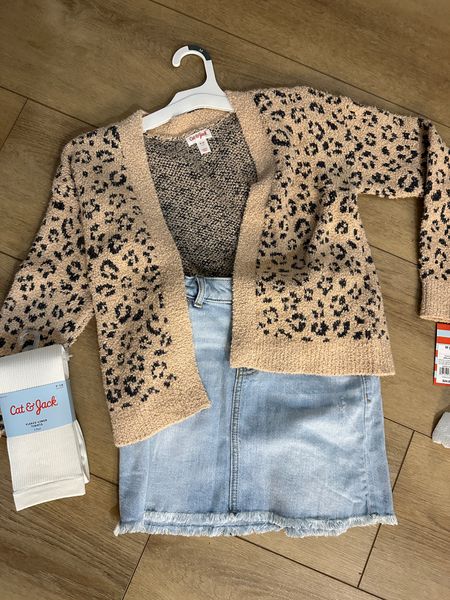 Fall outfits. Target girl clothes. Kids clothes. This skirt is on clearance and the cardigan is as soft as barefoot dreams!!! Also got some fleece lined tights to go with fall dresses and winter outfits. School clothes. Denim skirt. Leopard cardigan. 

#LTKfamily #LTKSeasonal #LTKkids