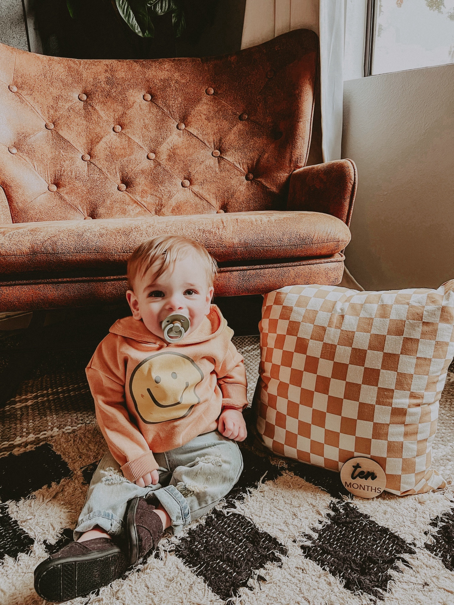 Baby smiley face hoodie sweatshirt! So cute!! 🥲 infant ripped jeans, baby Tom’s sneakers, checkered rug, brown rocking chair 💕

#LTKhome #LTKkids #LTKbaby
