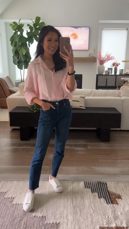 Casual spring outfit with a cotton button up shirt that’s actually part of a two piece short set and girlfriend jeans. Pairing with white leather sneakers that are super comfortable for walking and look chic. Wearing size small in the set, which has an oversized fit, 00 in the jeans and the sneakers fit true to size. 