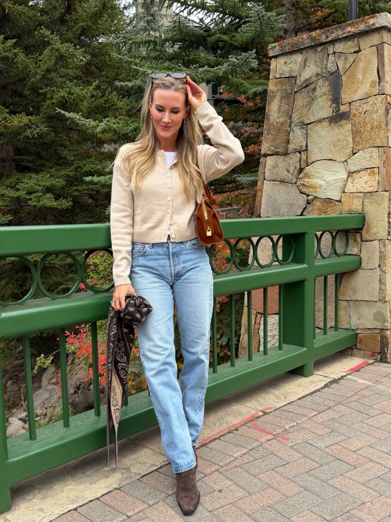 The kind of fall outfit I’ll wear on repeat 🍂 A soft neutral cardigan, perfectly relaxed straight leg jeans and chocolate brown ankle boots make the easiest elevated everyday combination. I love the mix of creamy beige, light wash denim and rich brown accessories for that effortless quiet luxury feel. Perfect for fall travel, lunch, shopping or a casual weekend in the mountains.

Shop my fall cardigan, jeans, boots, bag and accessories on LTK.