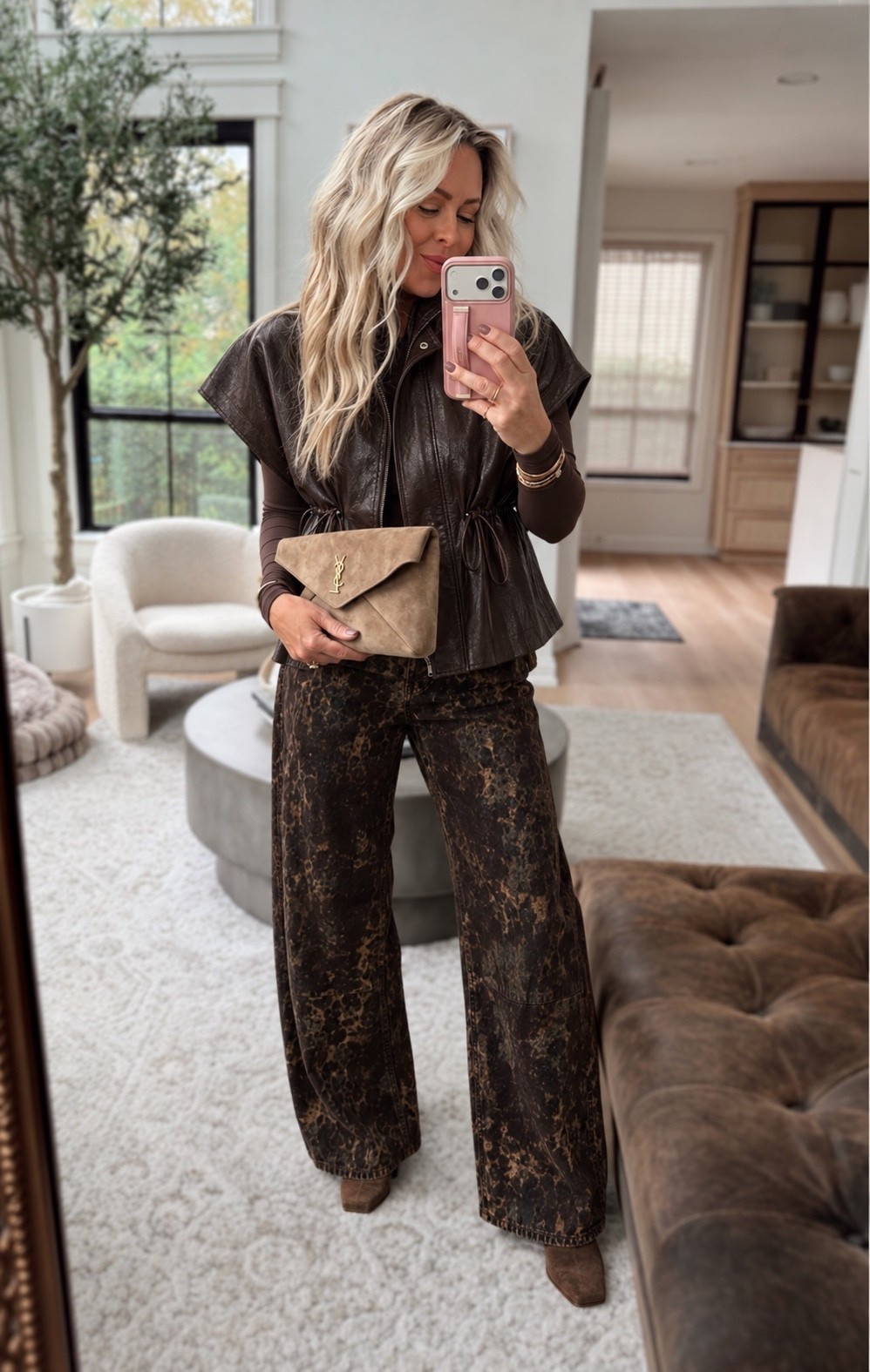 Chocolate brown is having a MOMENT this fall and I’m here for it! 🤎🍂 The leather vest, those statement jeans, and a little suede on suede with the bag and boots?! This entire look is giving expensive without trying too hard. Love mixing different shades and textures of brown for fall! 😍

Fall outfit ideas, brown leather vest, fall fashion trends 2026, wide leg jeans, chocolate brown outfit