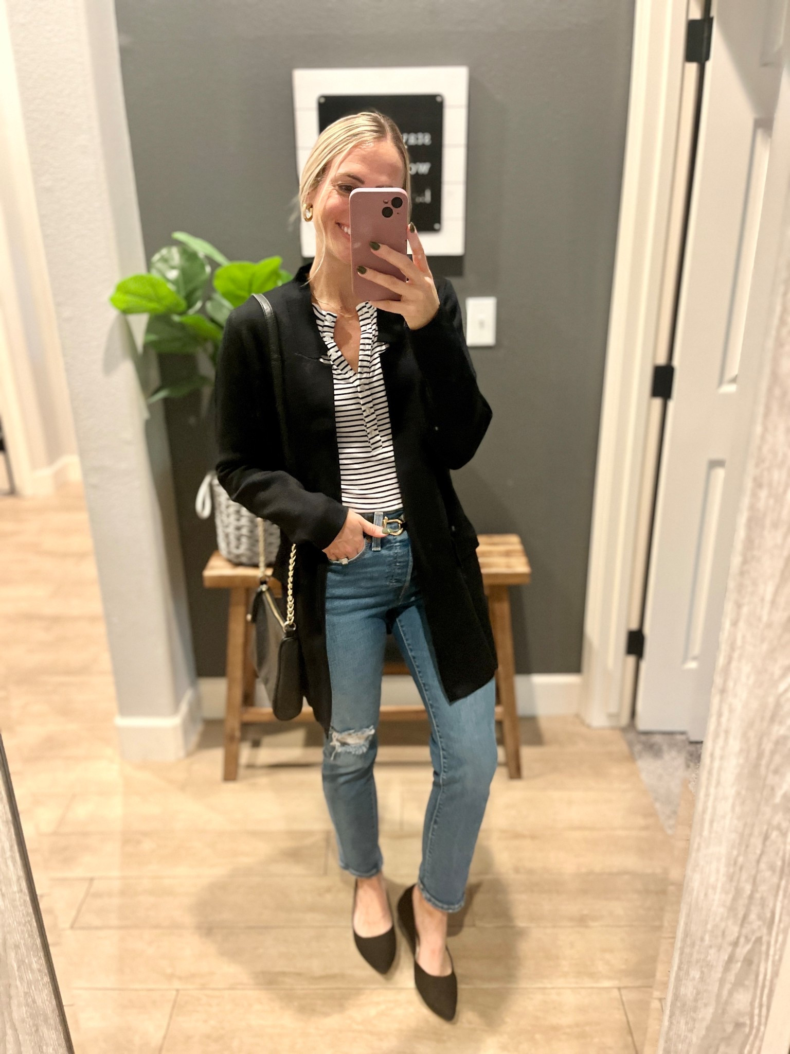 Recreate the look! 

Striped top or Henley 
Straight leg jeans 
Black belt 
Pointy black flats 
Black blazer (this one is a sweater material) 