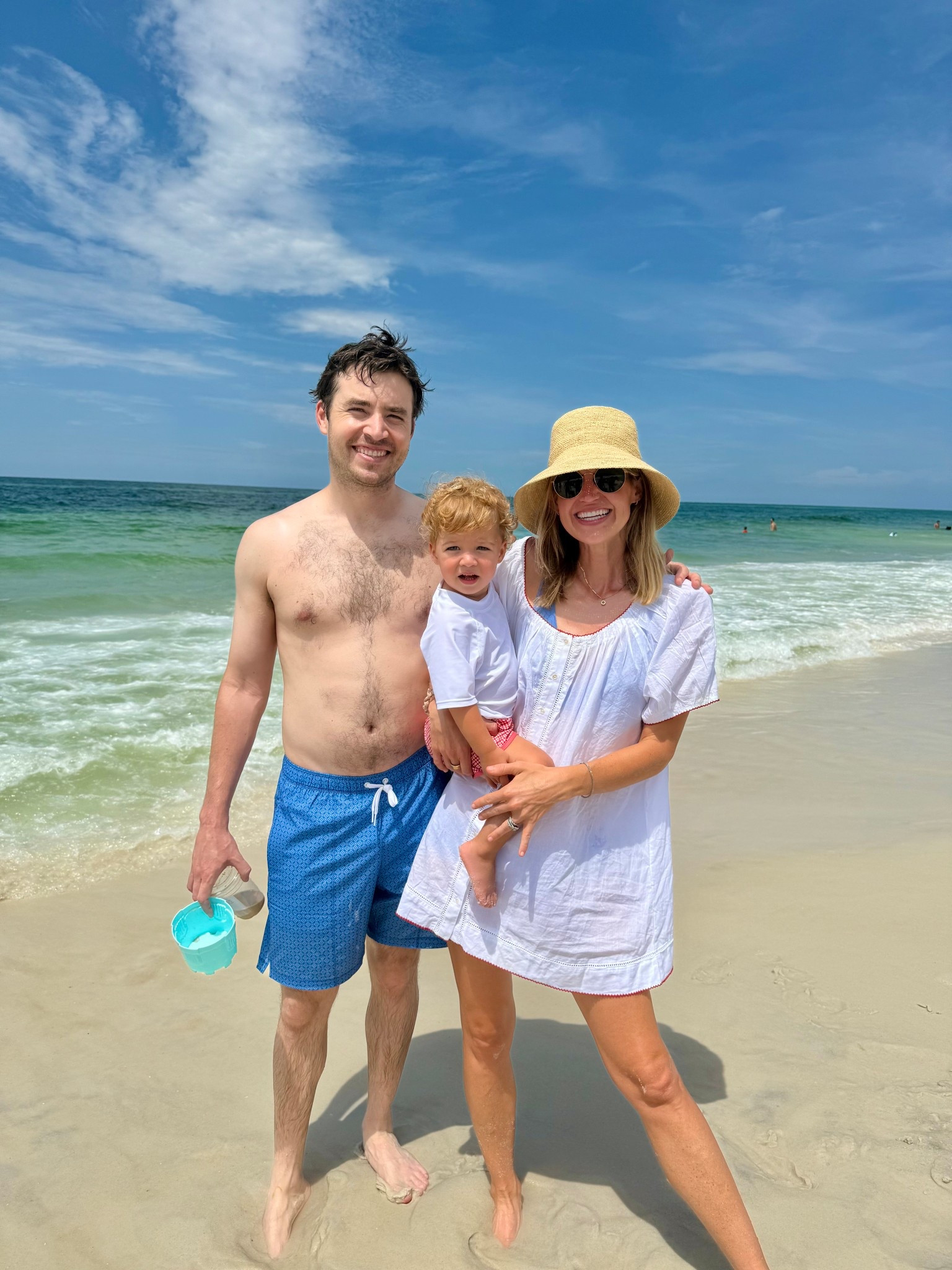 Family beach trip! Coop and I are both wearing Minnow swim. He is wearing the toddler gingham swim shorts and I’m wearing their new white cover up that is so cute. I bought something similar from H&M to compare and the Minnow one absolutely won. Worn with the janessa Leone hat - worth the hype

Beach style, beach cover up, swim cover up, white swim cover up, beach hat , 

 #LTKSwim #LTKFamily #LTKSeasonal