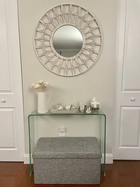 $39.99 30" ottoman on sale. Light gray shown. 

Love this foldable storage ottoman which is surprisingly sturdy and fits a lot.

Similar mirror shown. My exact one was a TJ Maxx find a few years ago for $59.99.

Wood flowers are available at Trader Joe's. $4.99 for 3 stems of large flowers or 5 stems of smaller flowers.

Exact glass console linked but it's sold out.

#LTKhome #LTKsalealert #LTKunder50