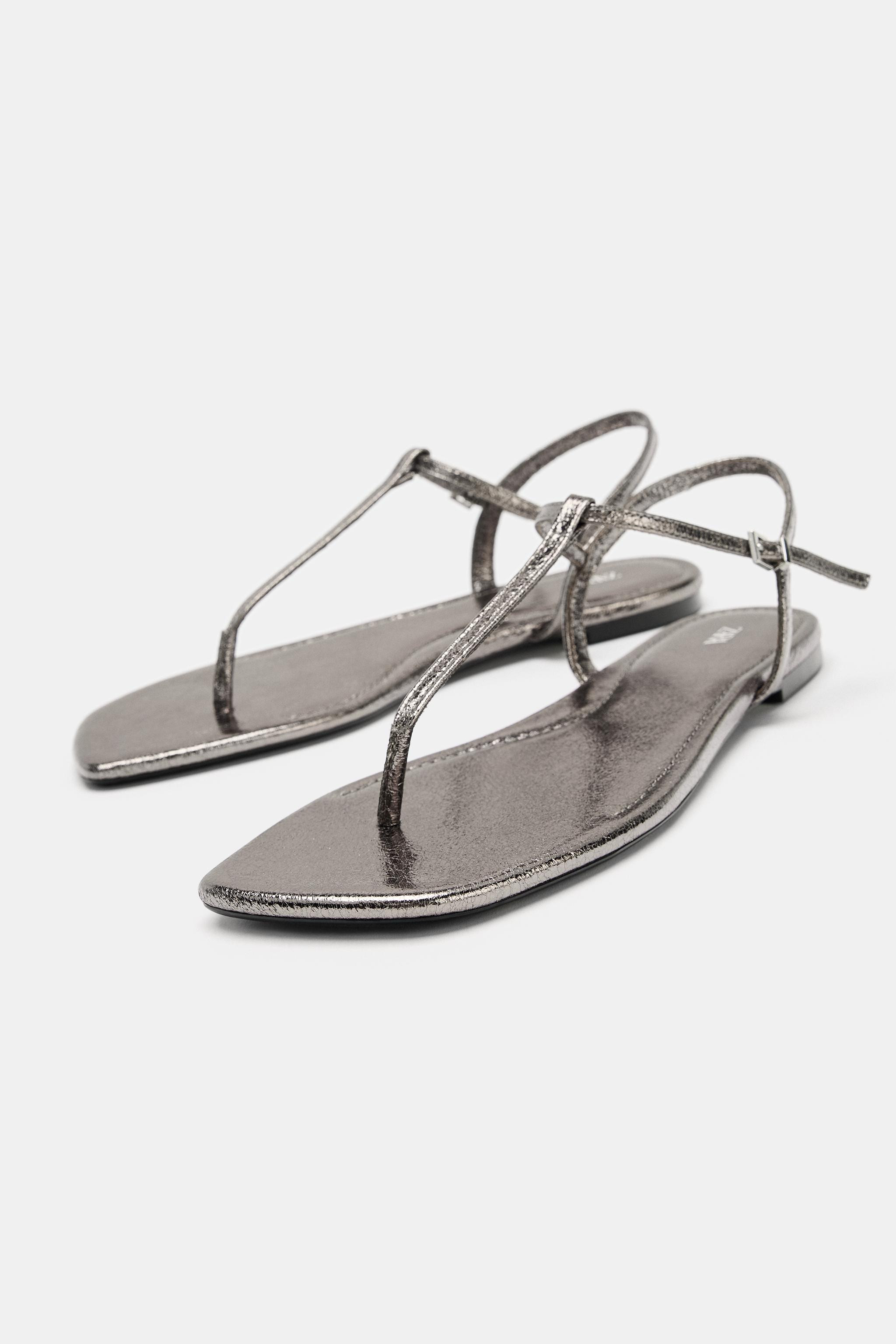 Flat sandals. Metallic top with a crackled effect. Strap across the front with a toe divider. Ank... | Zara UK