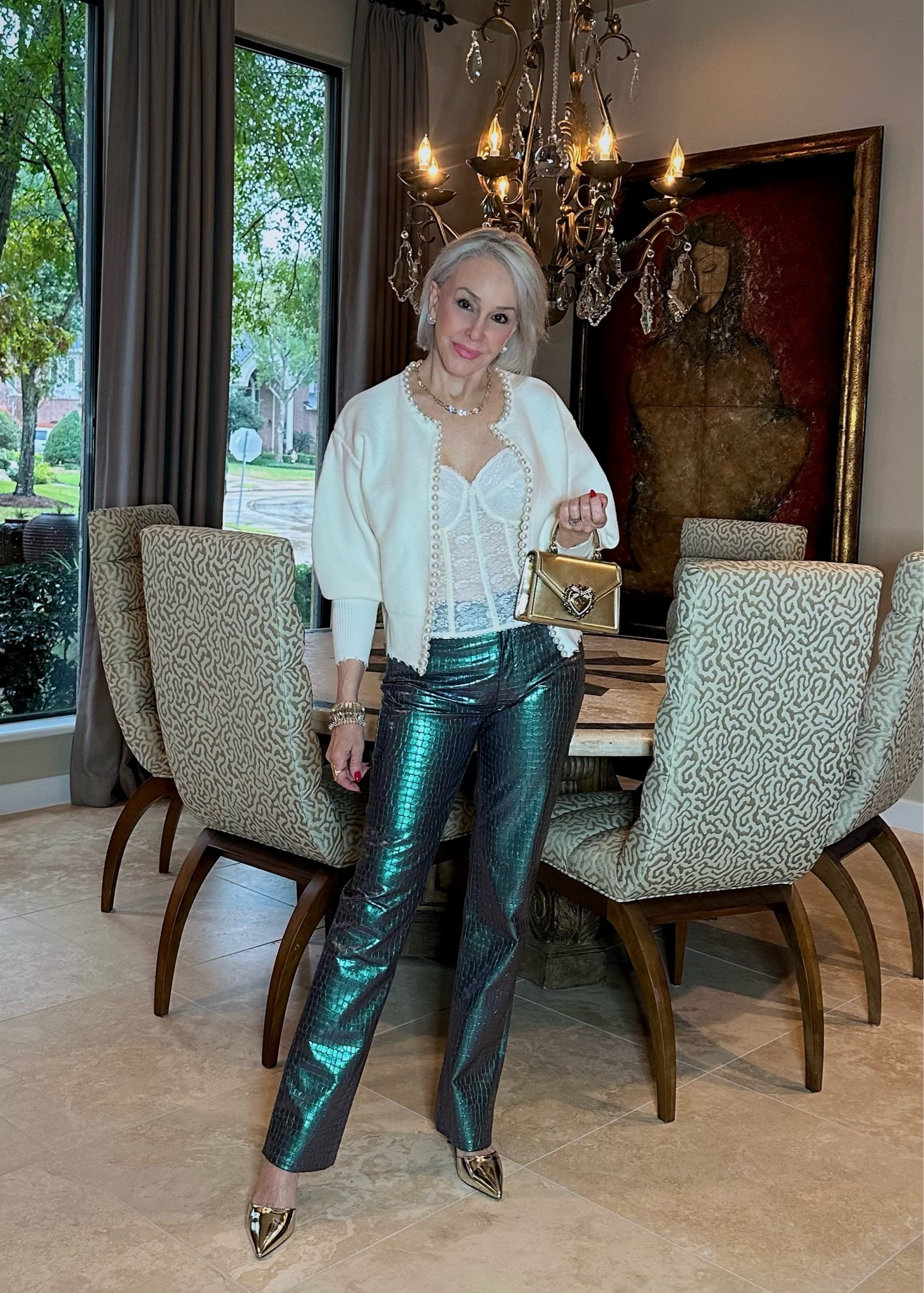 Best lace scenario……to looking sexy at any age and keeping it classy. Just add a blazer, denim jacket, or a pretty cardigan over a corset or bustier and let it peek out. Insta-sexy Perfect for your Valentines date night. Be sure to check out our Sexy and fun date night looks on the blog. 
Mermaid iridescent pants @revolve under $100, wearing a size 28
Cardigan sold out, linked similar
Gold pumps @zappos multil colors available-runs true to size
Bag @dolcegabbana 
Corset bustier- also in black @jcpenney 
Jewelry @kendrascott
Read the post www.shesheshow.com
#corset #bustier #fauxleatherpants #datenightlook #sexylook #romanticlook #goldpumps #goldbag #kendrascottjewelry #lace 

#LTKSeasonal #LTKunder100 #LTKFind