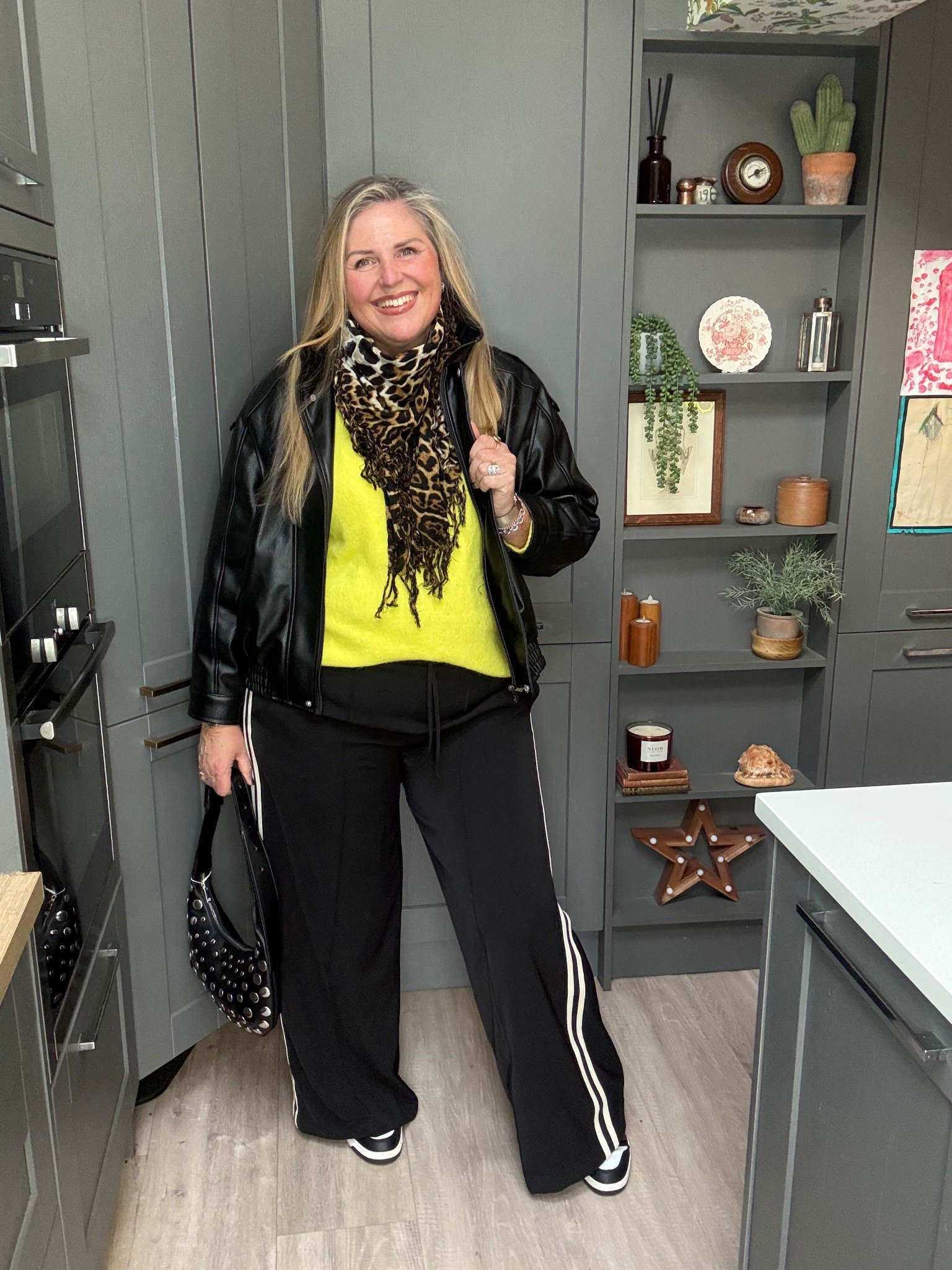 Neon jumper, faux leather jacket, wide leg trousers, black bag, black trainers 

#LTKwinter #LTKdatenight #LTKplussize